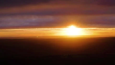 Magical Sunset with Dark British Landscape Below Stock Footage 327514116
