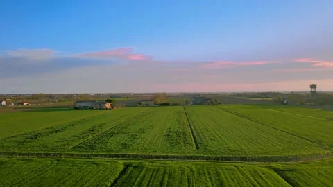 A magical sunset on the green fields, an extremely beautiful landscape Stock Footage 237518225