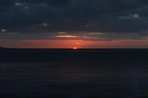 Magical sunset in the ocean Stock Photos