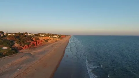 Magical sunset over the beach of Vale de Lobo. Tourist town of Portugal Stock Footage 69109688