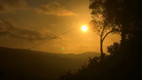 MAGICAL SUNSET OVER THE MOUNTAIN Stock Footage 102775105