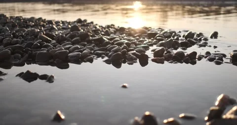 Magical sunset on the river. Low angle view of the river surface, 4k Stock Footage 142800785