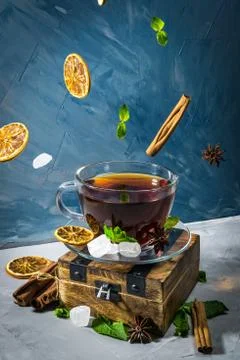 Magical tea concept. Levitating effect. Flying in air ingredients for tea Stock Photos
