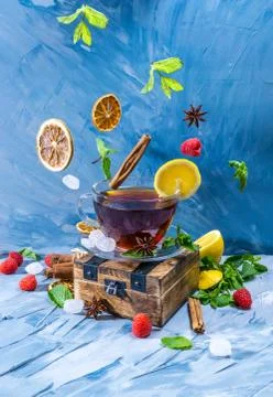 Magical tea concept. Levitating effect. Flying in air ingredients for tea Stock Photos