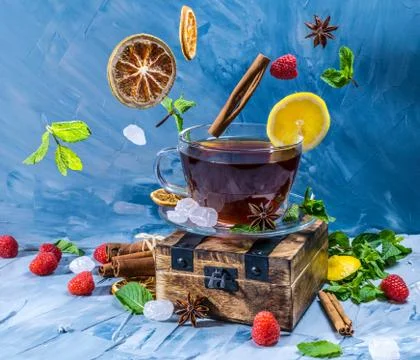 Magical tea concept. Levitating effect. Flying in air ingredients for tea Stock Photos