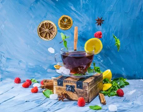 Magical tea concept. Levitating effect. Flying in air ingredients for tea Stock Photos