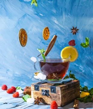 Magical tea concept. Levitating effect. Flying in air ingredients for tea Stock Photos