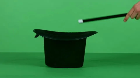 Magical trick with black top hat and a wand on green screen HD Video stock 46508564