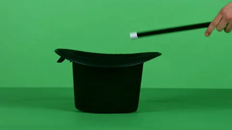 Magical trick with black top hat and a wand on green screen 4K Video stock 46509652