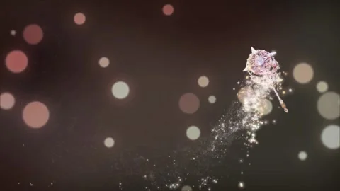 Magical wand casting glittering light particles against dark background with 動画素材 345330838