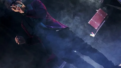 Magician doing a magic trick with smoke. Plane rotating in slow motion. Stock Footage 244321129