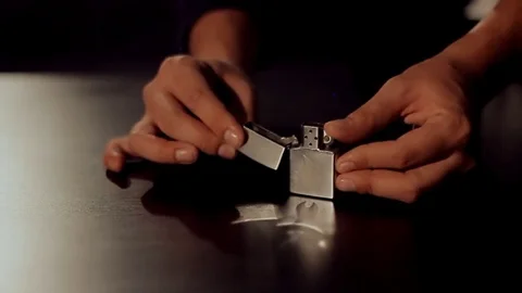 Magician making a trick with fire, lighter Stock Footage 75952341
