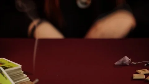 Magician performs a rite of black magic. Pendulum say Yes. Magical ritual. Stock Footage 108013385