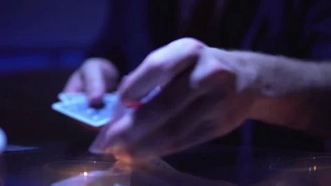 Magician Performs Trick with Cards in Dark, Mysterious Magic Stock Footage 80438293
