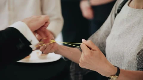 A magician performs a trick with an elastic band on his arm Stock Footage 312728165