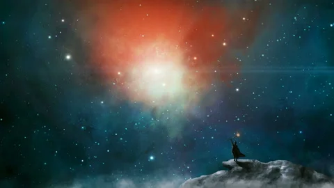 Magician standing in sci fi landscape on mountain, rock with fog and colorful Stock Footage 140867150