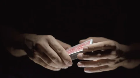 Magician's Hands Performing Card Trick. Manipulations with cards. 4k. Close-up Video stock 89580762