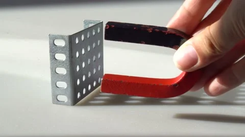 Magnet attracts the metal part Stock Footage 66057638