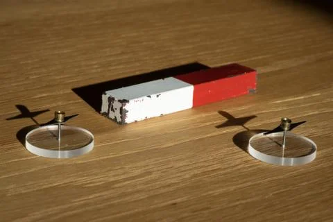Magnet bar with compass Stock Photos