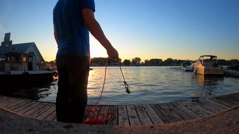 Magnet Fishing at the marina by the rive, Stock Video