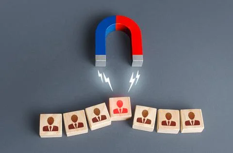 Magnet is trying to snatch a key irreplaceable employee from the team. Violat Stock Photos