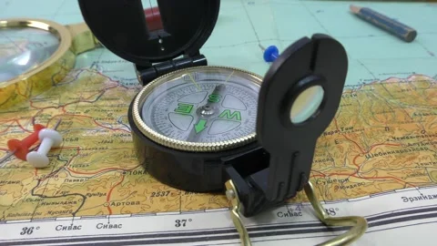 A magnetic compass, where it is used as a navigation tool, and a map are needed Stock Footage 133189545