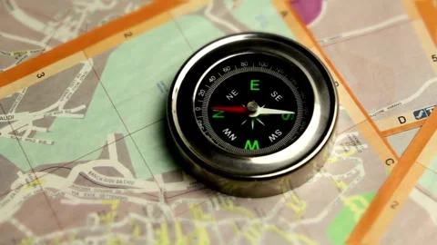 Magnetic compass on a world map, closeup. conceptual of global travel, tour.. Stock Footage 257871935
