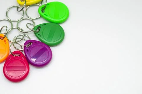 Magnetic key for the door intercom. Multicolored programmable chip keys. Copy Stock Photos