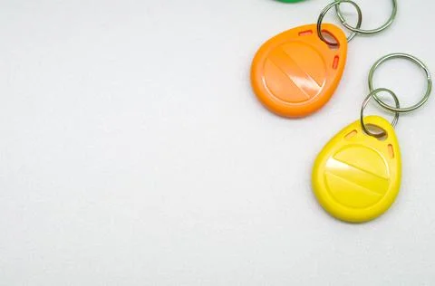 Magnetic key for the door intercom. Multicolored programmable chip keys. Copy Stock Photos