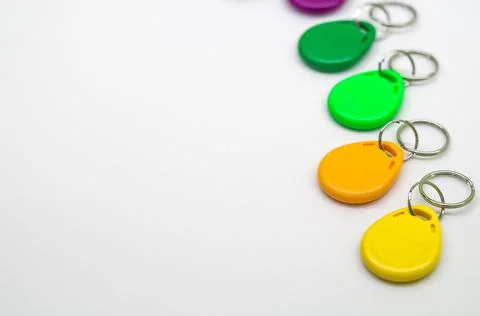 Magnetic key for the door intercom. Multicolored programmable chip keys. Copy Stock Photos