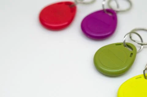 Magnetic key for the door intercom. Multicolored programmable chip keys. Copy Stock Photos