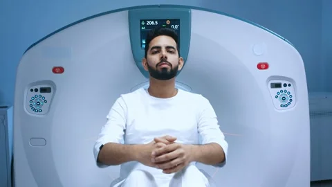 Magnetic resonance imaging computerized axial tomography. Patient finishing Stock Footage 266817718