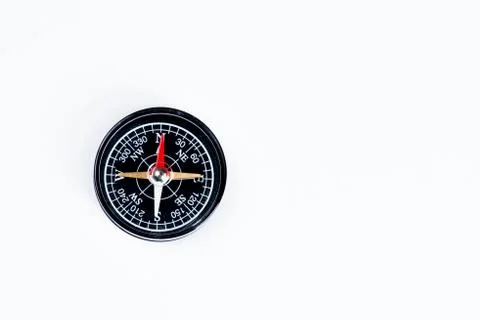 A magnetical compass on a white table. Stock Photos