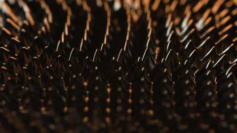 Magnetism and Orange light over ferrofluid oily substance moved by magnet Vídeo Stock 132889504