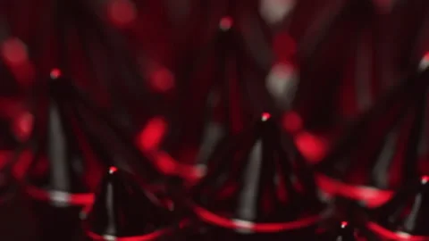 Magnetism and Red light over ferrofluid substances moved by neodymium magnet Video stock 132883739