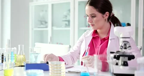 Magnetization of water or various liquids in magnetic mugs in laboratory Stock Footage 239470333