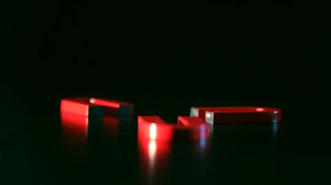 Magnets on dark background hd Stock Footage 39804851