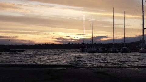 Magnificent cloudy warm orange evening sunset seascape sky over yacht silhouette Video stock 92922161