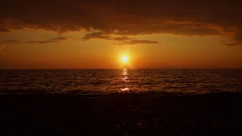 Magnificent dramatic sunset over the sea. Peace and tranquility Stock Footage 255741088