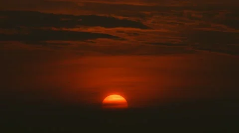 Magnificent low setting sun Stock Footage 55455731