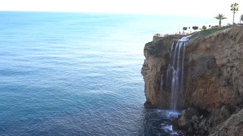 The magnificent Lower Duden Falls surrounded by tall rocky cliff Stock Footage 86447853