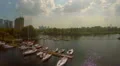 Magnificent panorama of small marina on city river, aerial shot HD Footage