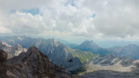 The magnificent sight of a mountain range accompanied by captivating cloud Stock Footage 245164574