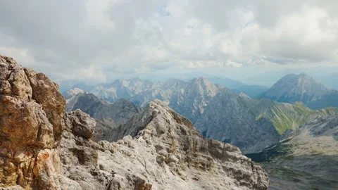 The magnificent sight of a mountain range accompanied by captivating cloud Stock Footage 245166143