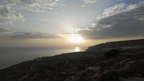 Magnificent sundown view from Ghar Lapsi with the surrounding rocky landscape 動画素材 307391791