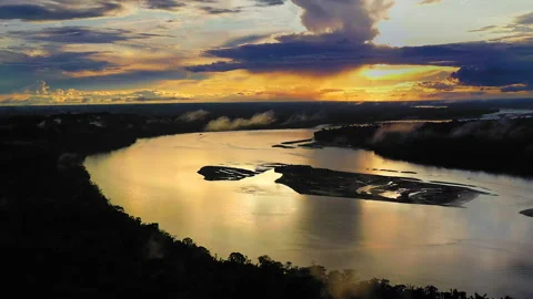 Magnificent Sunset over the impressive Amazon Rainforest with the River Stock Footage 247897486