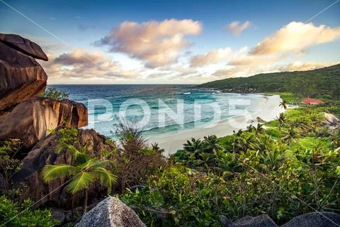 Magnificent sunset over a tropical beach Stock Photos