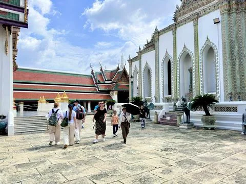 Magnificent white building decorated with multi colored porcelain at Wat Phra Stock Photos