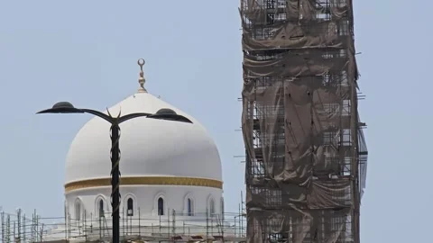 A magnificent white mosque, featuring multiple domes new construction Stock Footage 311885560
