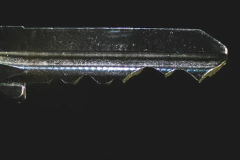 Magnified key image on the black background Stock Photos